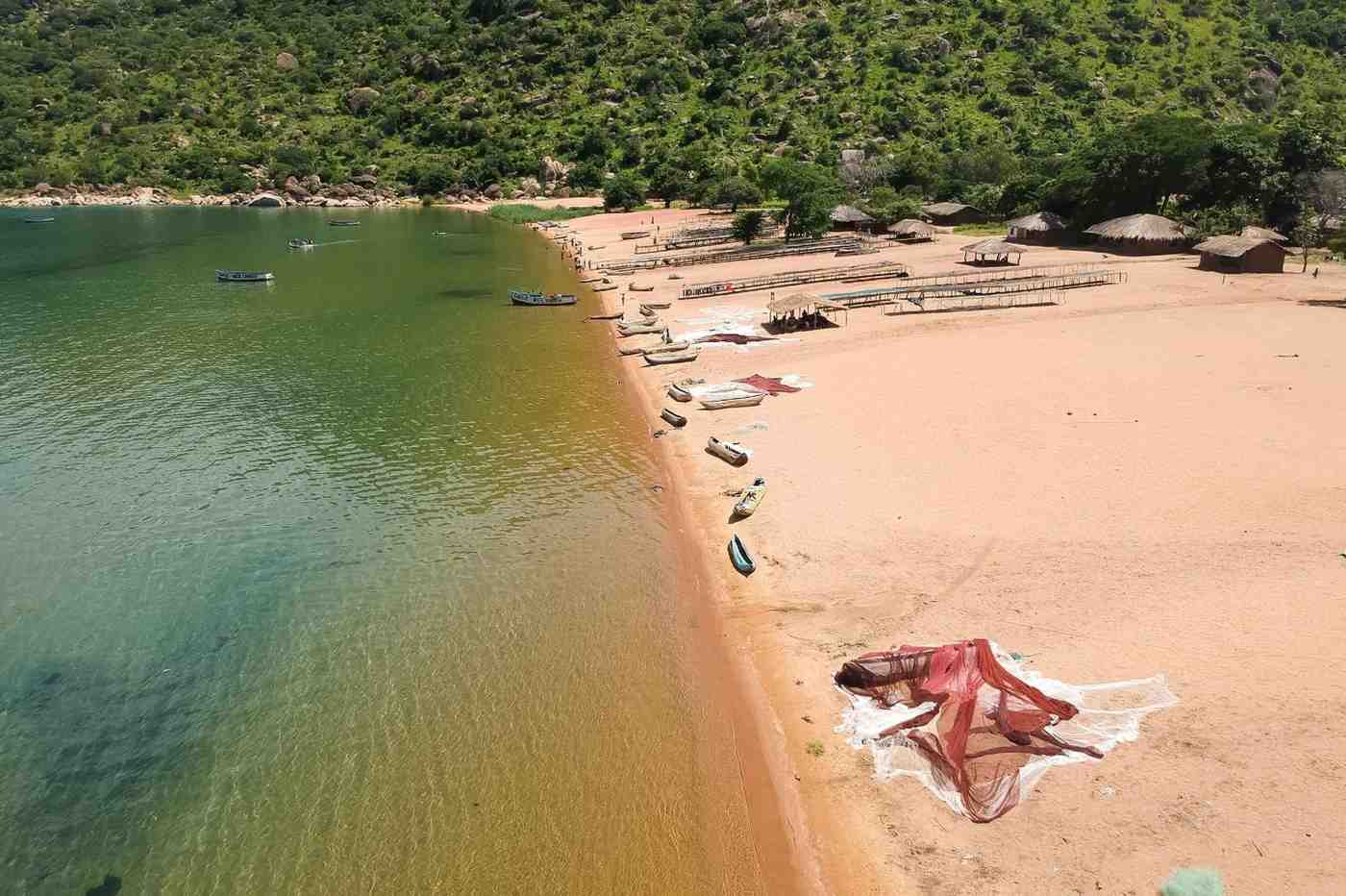 Beach With Fishermen Boats And Net