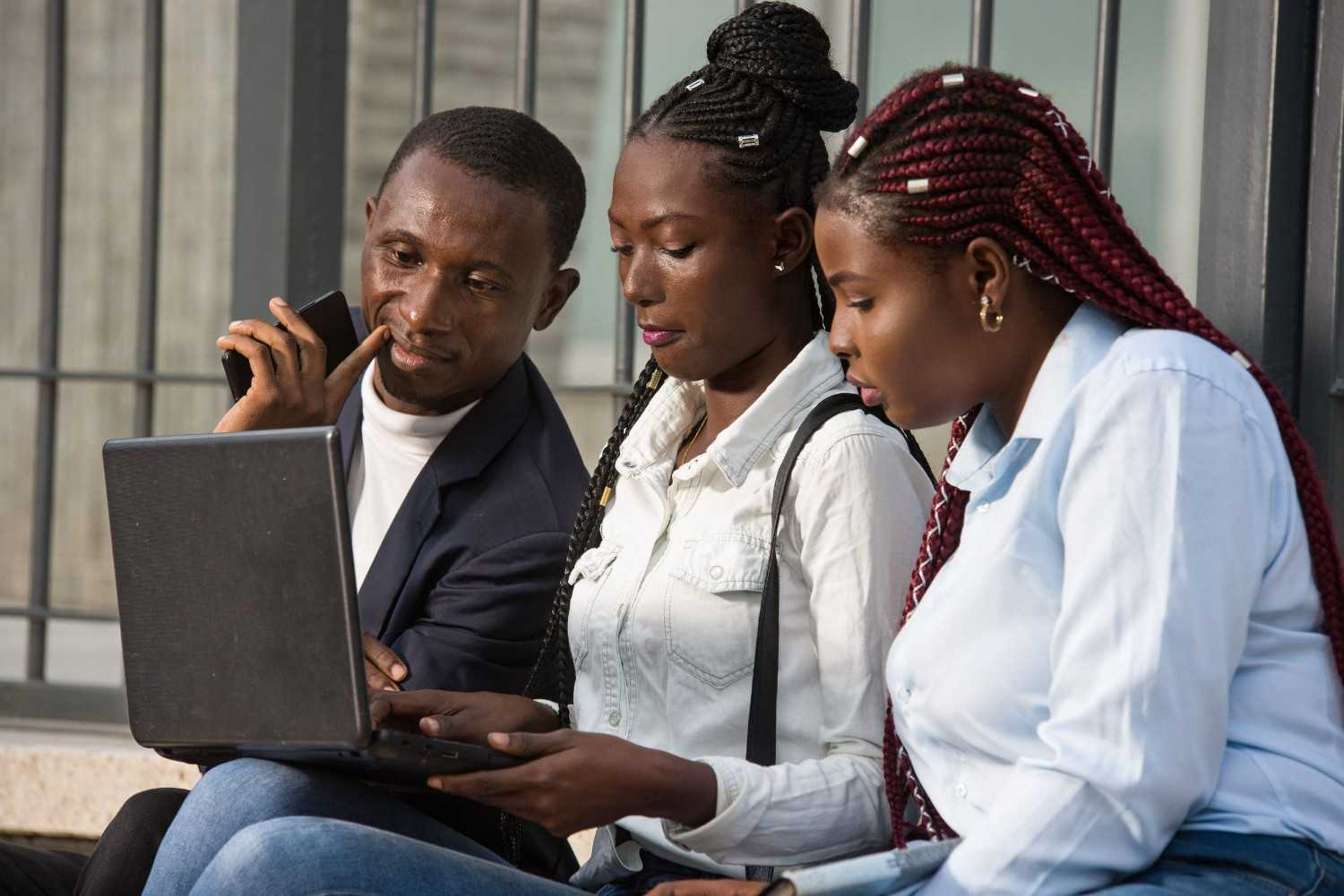 Group Of Young People Using Smart Computers