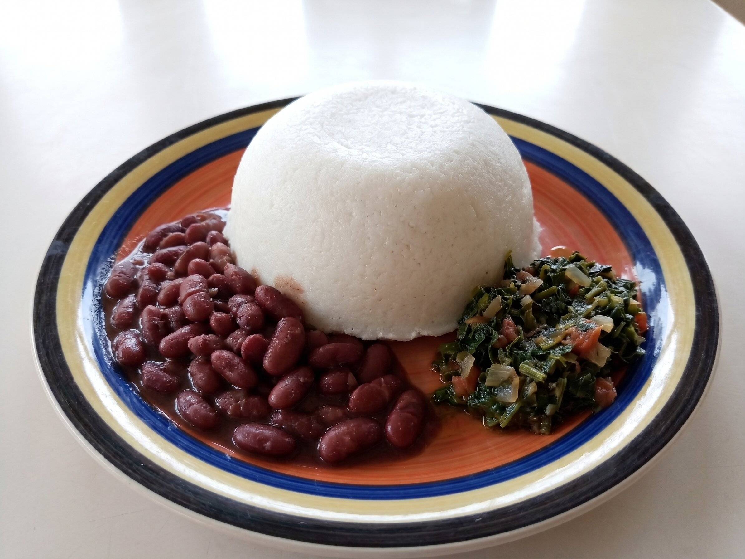 Nsima Served With Beans And Greens