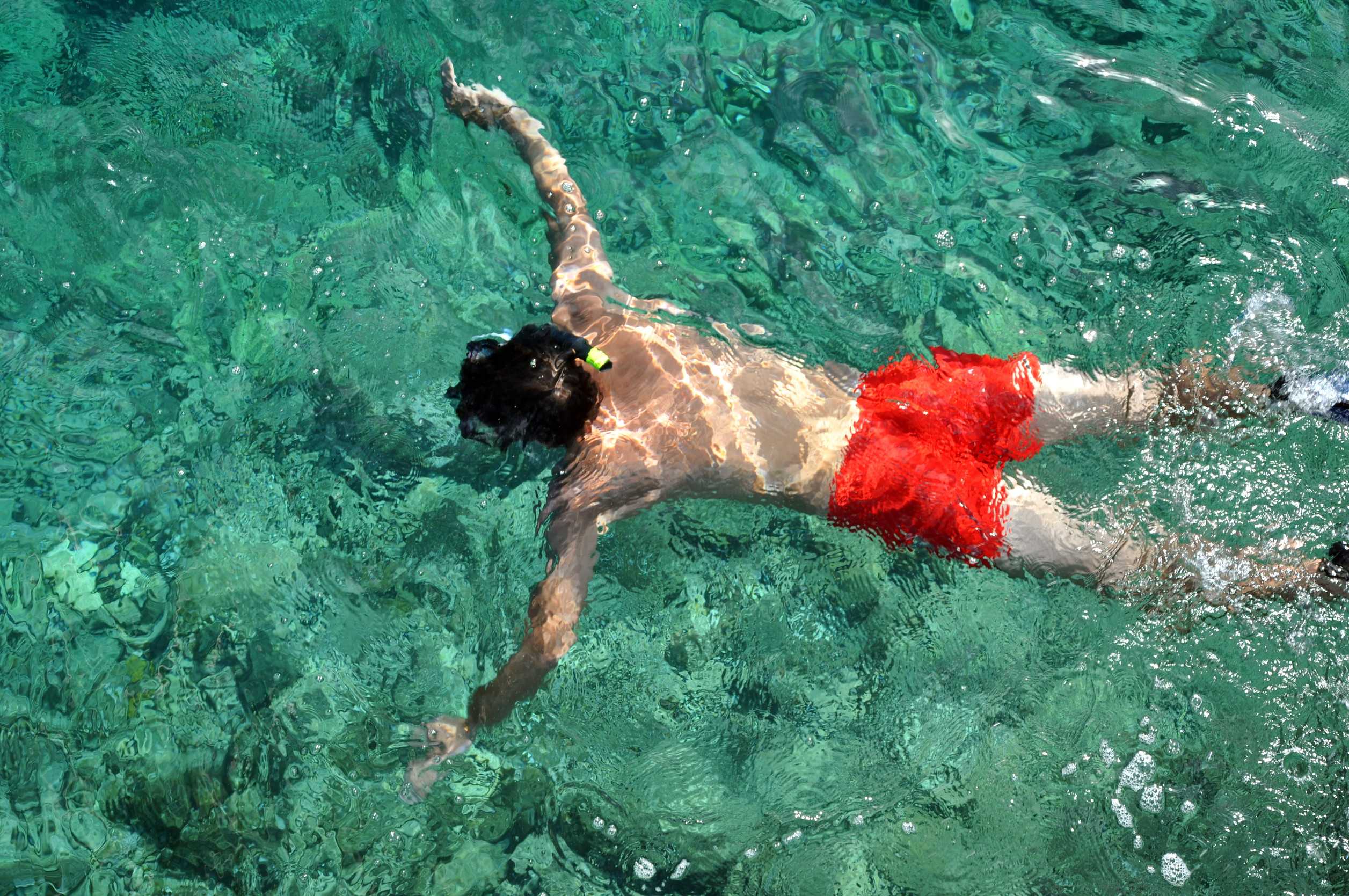 Tourist doing snorkelling underwater