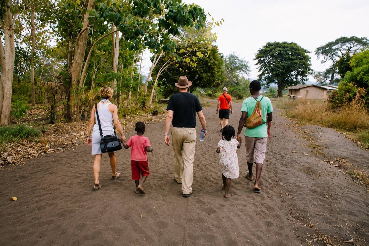 Travellers visiting a traditional Malawian village